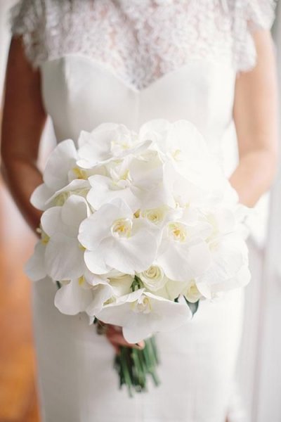 03-an-all-white-orchid-wedding-bouquet-is-timeless-classics-to-rock (1).jpg