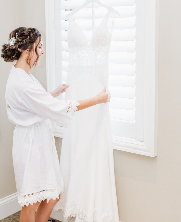 Bride-getting-ready-for-the-wedding-with-bridal-robe.jpeg