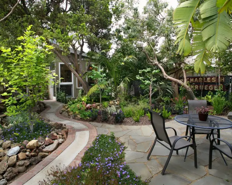 Bright-Flagstonbrick-walkway-brown-exterior-brown-siding-Concrete.webp