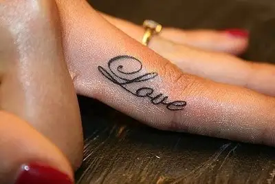 love-word-tattoo-on-finger.webp