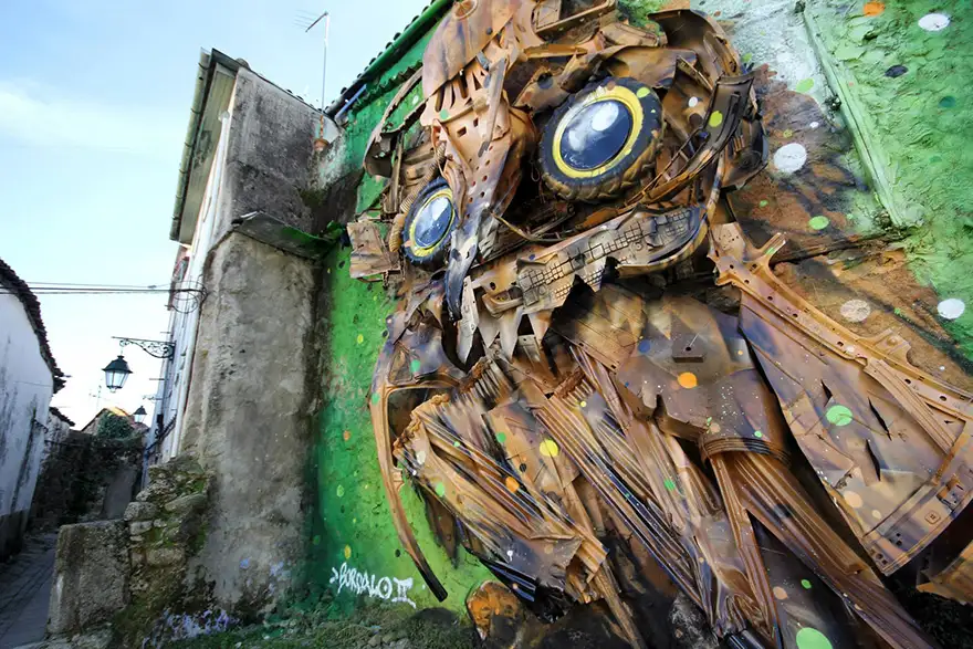 recycled-owl-sculpture-street-art-owl-eyes-artur-bordalo-6.webp