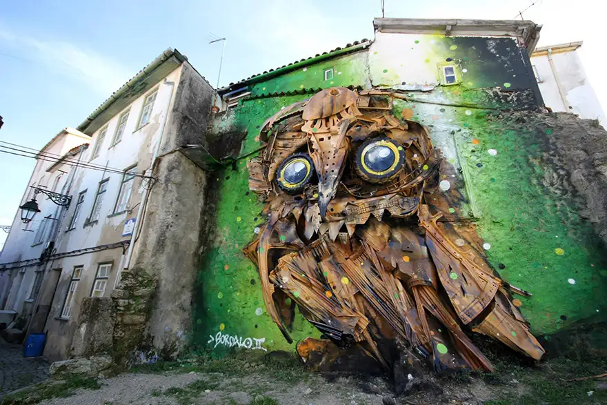 recycled-owl-sculpture-street-art-owl-eyes-artur-bordalo-7.webp