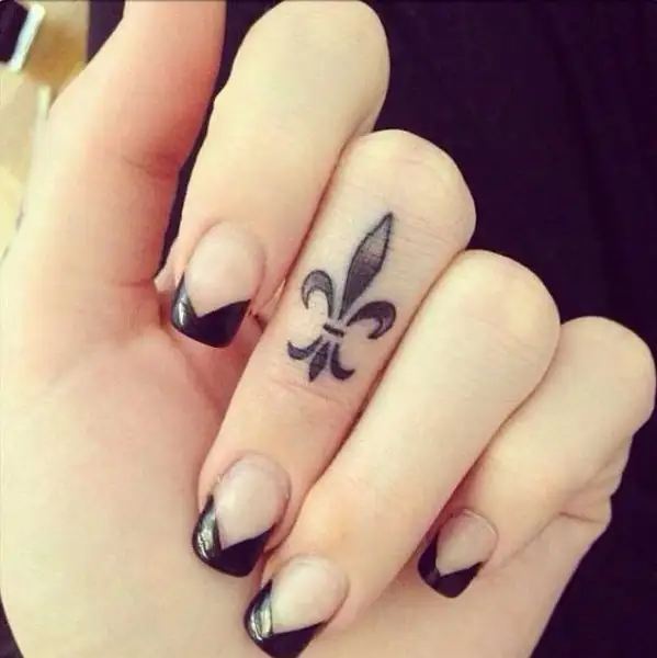 Smallest-Cool-Fleur-De-Lis-Tattoo-On-Girl-Finger.webp