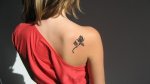 $black-rose-tattoo-on-the-back-300x168.jpg