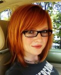 $sexy-redhead-in-car-with-glasses.jpg