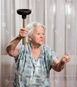 41387043-angry-old-woman-with-a-vantuz-at-home.jpg