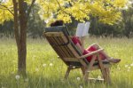 $woman-reading-book-outside-275px.jpg