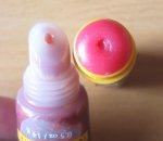 $Burts-Bees-Super-Shiny-Lip-Gloss-in-Zesty-Red-and-Lip-Balm-in-Pomegranate.jpg