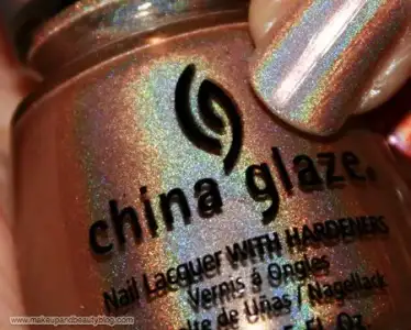 $china-glaze-645-fyi   holographic beige with silver, blue and green.webp