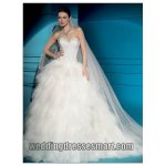 $tulle-strapless-sweetheart-neckline-with-beaded-bodice-and-puffy-multi-tiered-ball-gown-in-chape.jpg