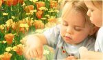 $TwoChildren_OrangeFlowers_b400X233.jpg